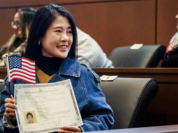 ‘Such a privilege’: 14 people from 8 countries take citizenship oath