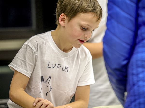 Young authors present their books to parents at Sanger Branch Library