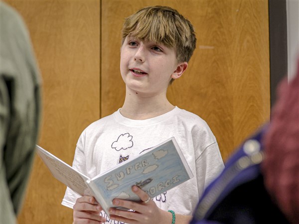 Young authors present their books to parents at Sanger Branch Library