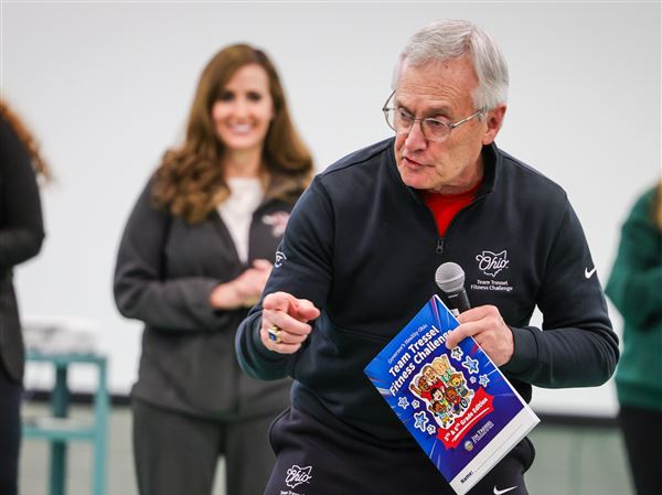 Lt. Gov. Jim Tressel exercises with students at Our Lady of Perpetual Help