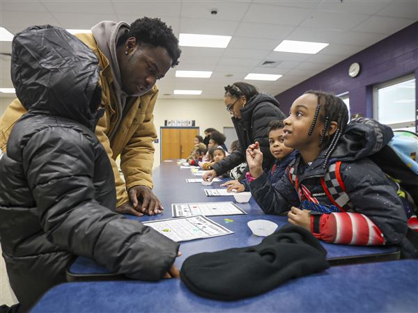 Photo Gallery: Toledo football players call bingo squares for Keyser Elementary students
