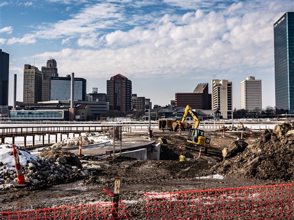 Photo Gallery: Construction work is part of a mild-temperature day in East Toledo
