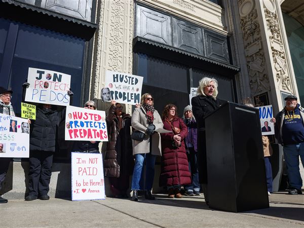 Demonstrators stage protest outside U.S. Sen. Jon Husted’s Toledo office