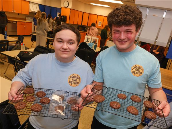 Local students bake hundreds of cookies for charities through nonprofit
