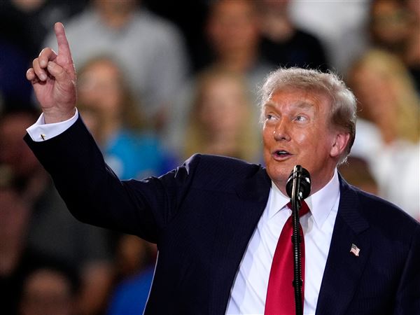 Trump defends his tariffs during Michigan visit even as businesses say they've hurt the state