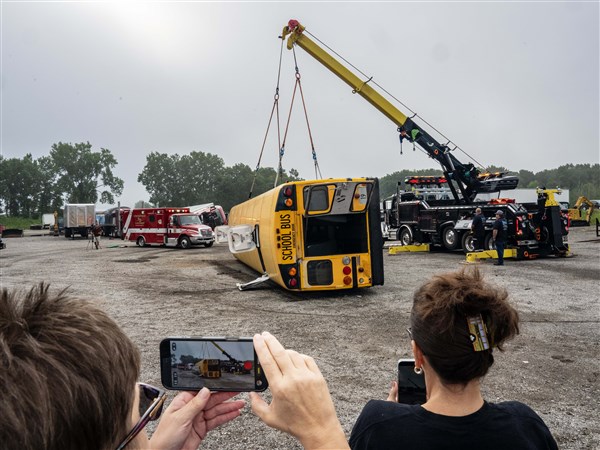 Bus drivers observe rollover crash during safety demonstration