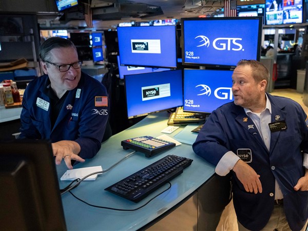 Stocks fall on Wall Street as oil prices jump back above $100 a barrel