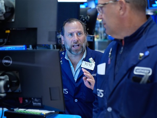 Wall Street holds near its record after Brent oil falls below $100 per barrel